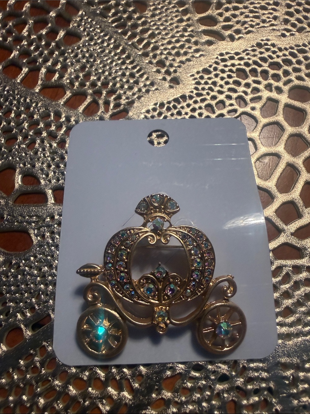 Gold-tone Jeweled Carriage Brooch with Iridescent Stones